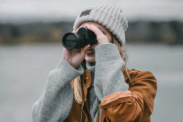 Woman Using A Monocular